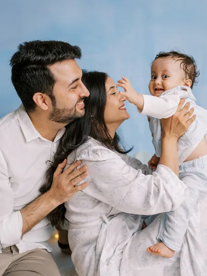 A family portrait from the same session, showing everyone together, happy and celebrating this special milestone.