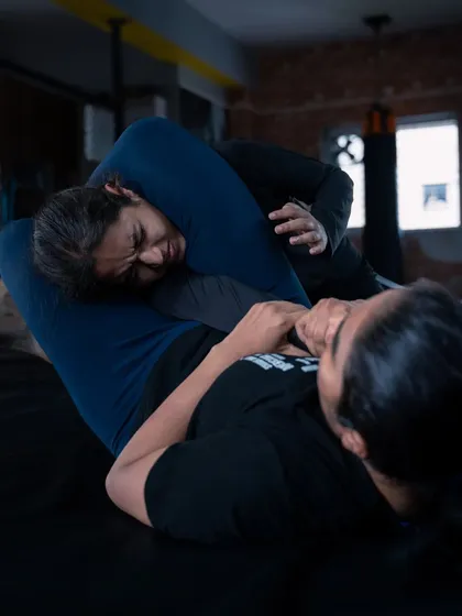 Strength, technique, and trust. Our women's grappling classes are a core part of our gym, focusing on practical Brazilian Jiu-Jitsu and self-defense skills. Here, our fighters are drilling submission techniques, building the confidence and ability to control any situation on the mat.