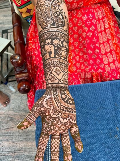 Another shot of the same arm, highlighting the fine details and clean lines of the artwork.