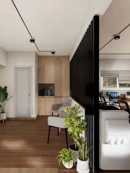 In this view, you can see how black vertical slats create soft separation in the open office without blocking light or flow. This detail, combined with indoor plants and warm wood tones, helps ground the space and adds visual relief to the monochrome palette.
