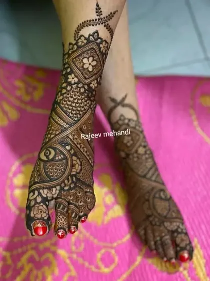 An asymmetrical foot design, with a large peacock on one foot and a flowing paisley pattern on the other.