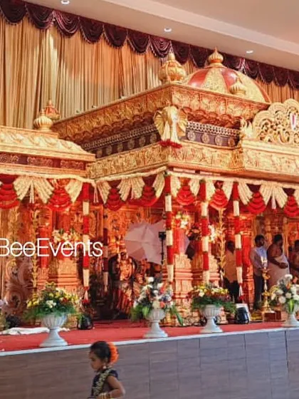 A wide shot of the grand temple-style wedding mantap, showcasing its impressive scale and intricate details. This setup is perfect for clients who want a truly majestic and traditional wedding ceremony.