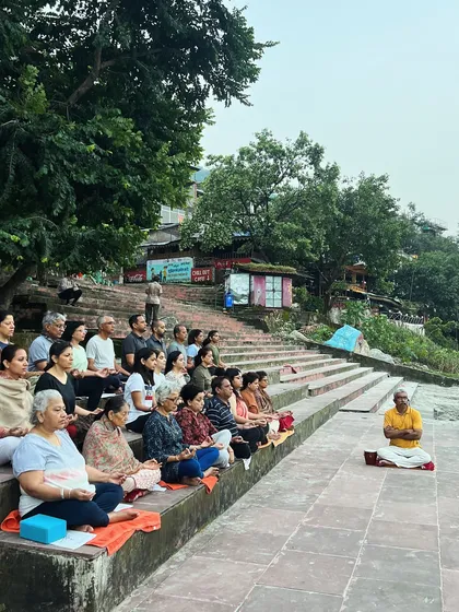 The entire group immersed in meditation by the river. The collective energy of a group meditating together is incredibly powerful and uplifting.