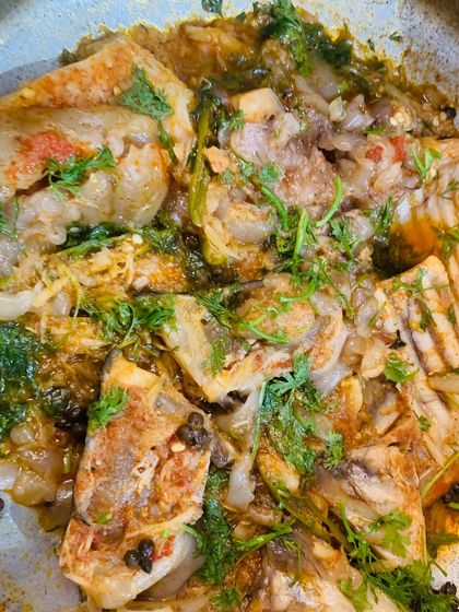 Another shot of the fatty fish curry, garnished with fresh coriander.