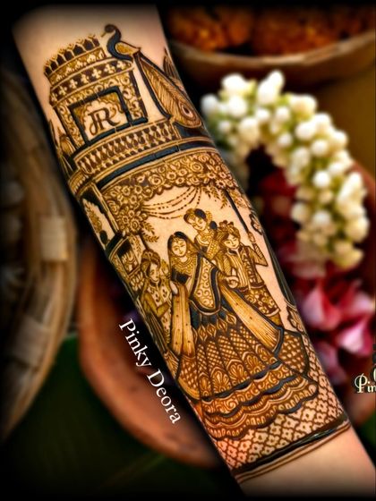 The completed family portrait on the bride's arm, showing the fine details and shading that bring the figures to life.