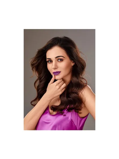 A vintage beauty shot from 2018. The styling here was about creating a bold, confident look with a vibrant purple lip and a simple satin top, letting the makeup do all the talking.