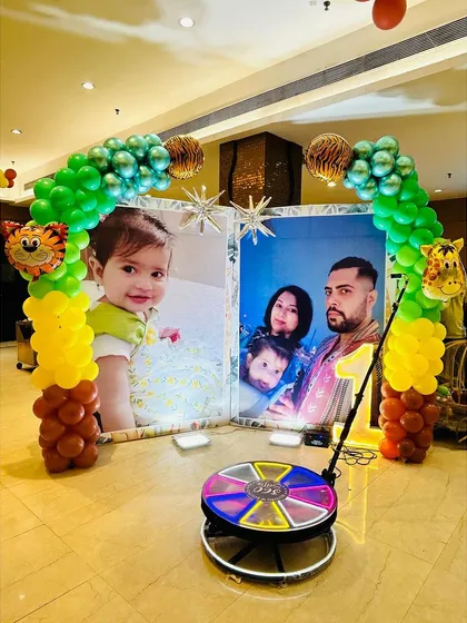 I help you capture memories from every angle. This is my 360-degree video booth, set up here for a Jungle theme party, which lets guests create fun, shareable slow-motion videos, a perfect digital souvenir from the celebration.