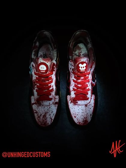A top-down view of the gory customs. The replaceable swooshes feature a stitched-up Mr. Meeseeks head and a mangled Mickey.