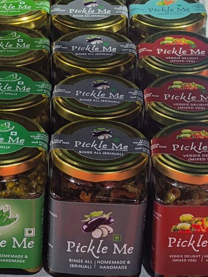Our vegetarian pickle range includes unique flavours like Spicy Chilly, Binge All (Brinjal), and the classic Mixed Veg. Each one is a testament to our commitment to homemade quality.