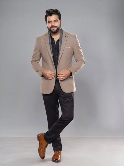For the Zee Chitra Gaurav awards, I styled Kshitish Date in this smart-casual look featuring a tan blazer and a stylish scarf.