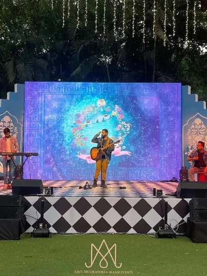 The stage in action with a live band, showing how the Moroccan-inspired backdrop and checkered stage floor create a dynamic and visually interesting performance area.