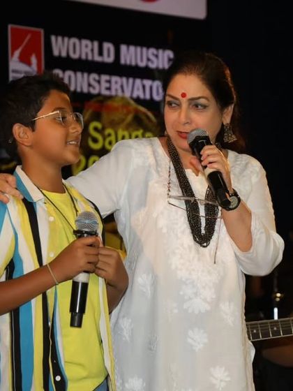 A proud moment between a guru and her student on stage at Kalaa Sangama 2023. We foster a supportive relationship between our teachers and performers.