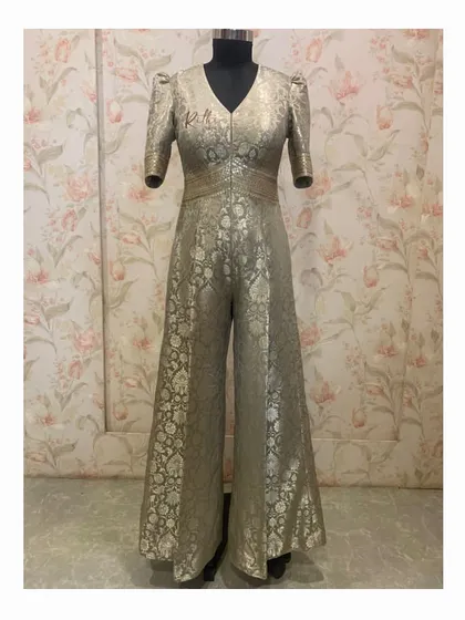 A unique Banarasi brocade silk jumpsuit. This fusion piece combines the richness of traditional fabric with a modern, wide-leg jumpsuit silhouette.