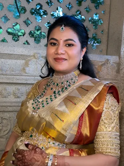 A beautiful portrait showcasing a complete traditional look. The makeup features defined eyes and a balanced complexion, designed to photograph beautifully and last all day.