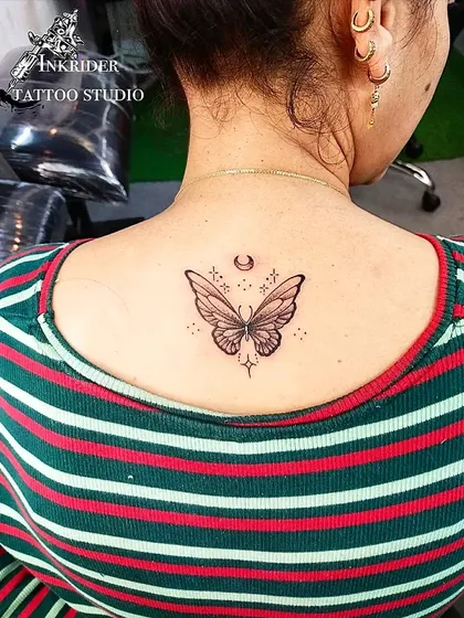 A beautiful butterfly on the back, surrounded by stars and a crescent moon. This design combines natural beauty with a touch of celestial magic.