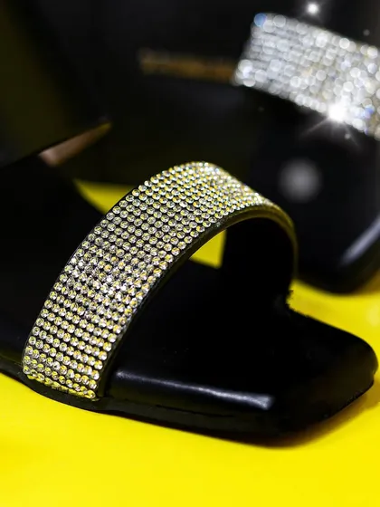 This detailed shot of a Dressberry sandal highlights the sparkling strap and sleek design. I use bold, contrasting colors and sharp lighting to create striking e-commerce and fashion accessory images that grab attention.