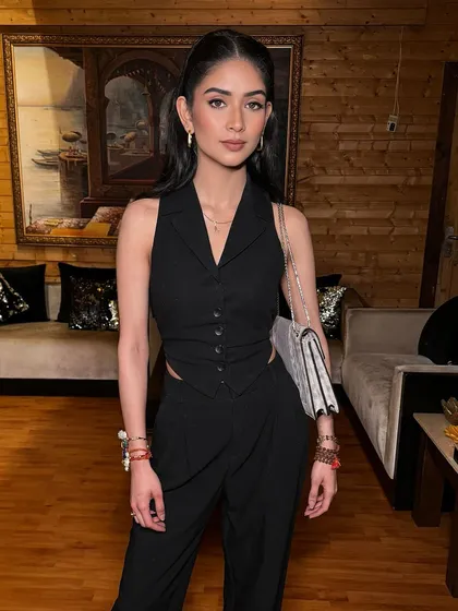 The complete look, showcasing a sleek and sophisticated hairstyle for an editorial vibe.