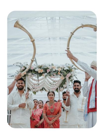 The bride's grand entrance, heralded by traditional horn blowers, a truly majestic moment.