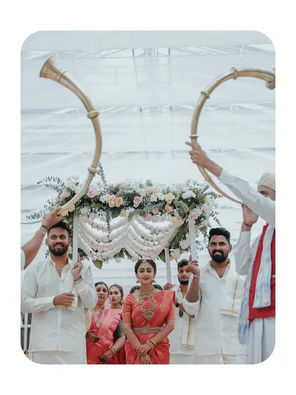 The bride's grand entrance, heralded by traditional horn blowers, a truly majestic moment.