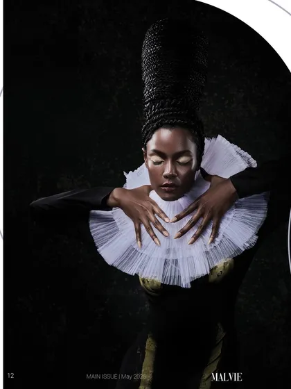 A regal portrait for Malvie Magazine featuring custom architectural hair and a dramatic ruffled collar, lit to create a sense of historical elegance.