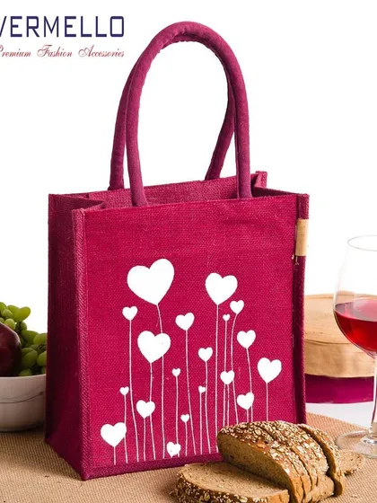 Our capabilities include producing fully dyed jute bags in your brand's specific colors. This vibrant magenta tote, shown with a custom heart print, is an excellent example of a personalized gift bag suitable for special occasions or as branded merchandise.