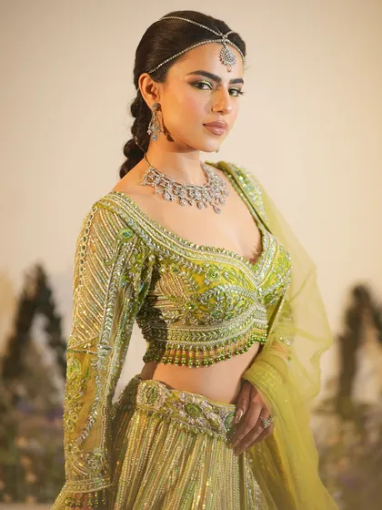 A closer view of the yellow mehendi makeup, showing the clean skin and subtle color on the eyes.