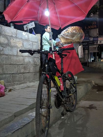A cycle parked next to a street-side golgappa vendor near Kundalahalli. Our impromptu rides often end with satisfying our cravings for local street food.
