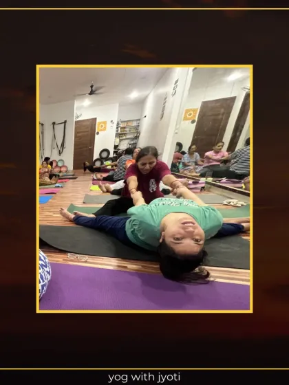 A student receives a gentle assist in a supine twist, helping to release spinal tension.