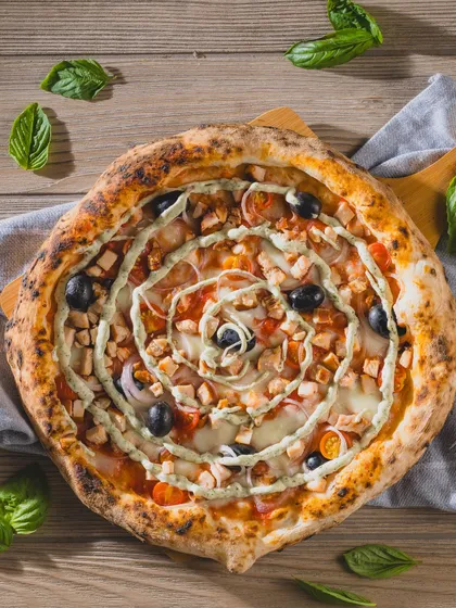 Our Smoked Chicken Neapolitan Pizza combines tender, smoky chicken with a perfectly charred, airy crust.