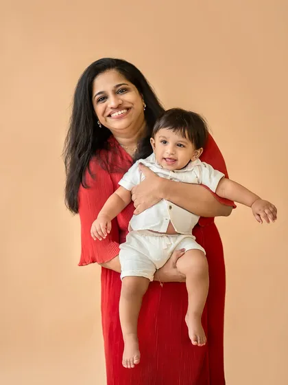 A beautiful mother and child portrait. The baby's happy expression and the mother's loving smile say it all.