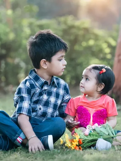 The sweet, unspoken connection between a brother and sister is one of my favorite stories to tell. I focus on capturing these gentle, candid moments that show the beginning of a lifelong friendship.