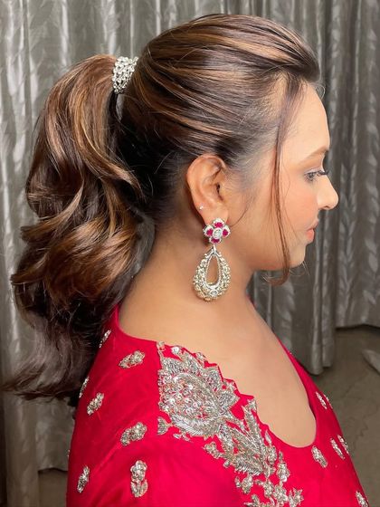 A view of the chic and bouncy ponytail, a great hairstyle choice that is both elegant and comfortable for a pre-wedding event.