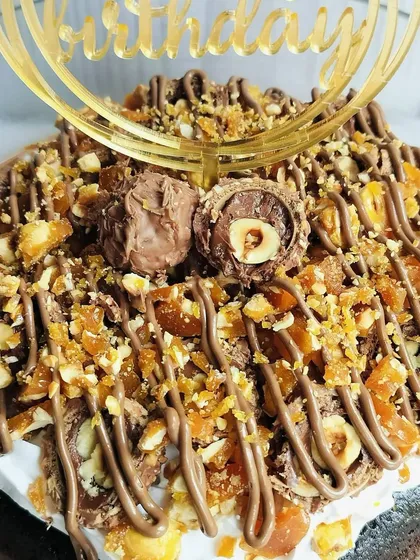 For the ultimate chocolate hazelnut lover, I created this Choco Rocher Tres Leches. It's a decadent treat crowned with crunchy hazelnut praline and Ferrero Rocher chocolates.
