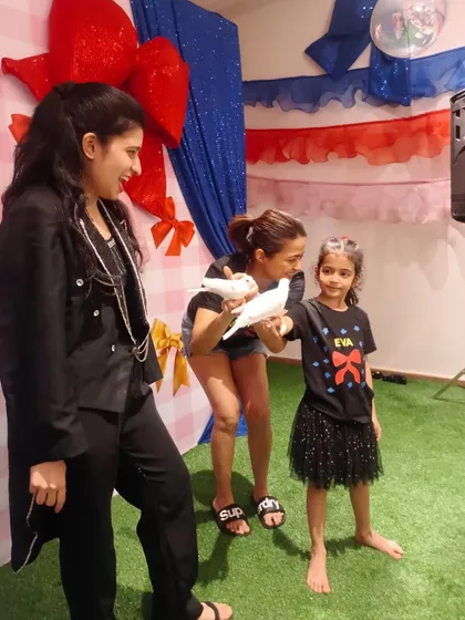 It was a joy performing for Surveen Chawla's daughter's birthday. Here, her daughter gets to meet one of my gentle doves. It's a special moment when kids can safely interact with the animals after the show.