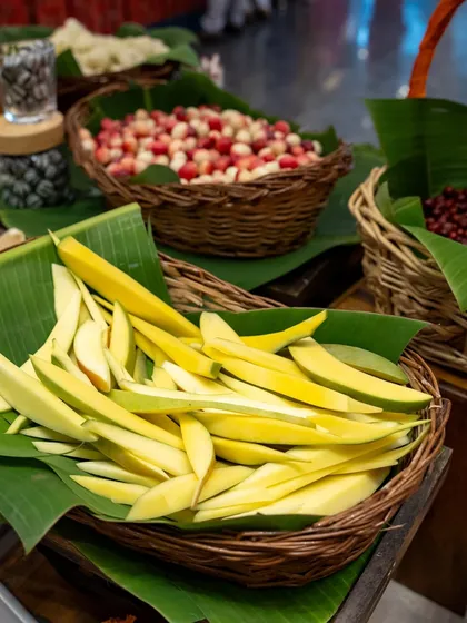 Freshly sliced raw mangoes, ready to be sprinkled with salt and chili. This simple, tangy snack is a highlight of our nostalgic food counters and a universal favourite.