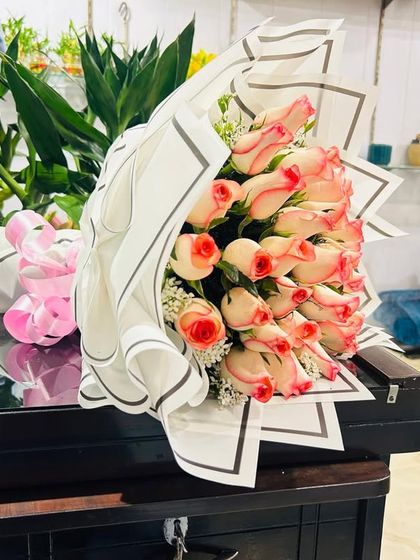 A beautiful bouquet of two-toned pink and white roses. This is a popular choice for birthdays, thank you gifts, or for celebrating a new baby.