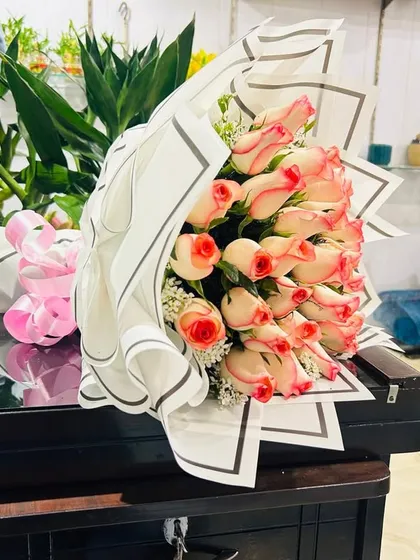 A beautiful bouquet of two-toned pink and white roses. This is a popular choice for birthdays, thank you gifts, or for celebrating a new baby.