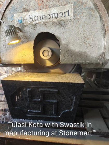 A new model of a Tulsi Kota, or Tulsi Vrindavan, with a Swastik symbol in production. This piece is being cut and shaped from a block of black granite.