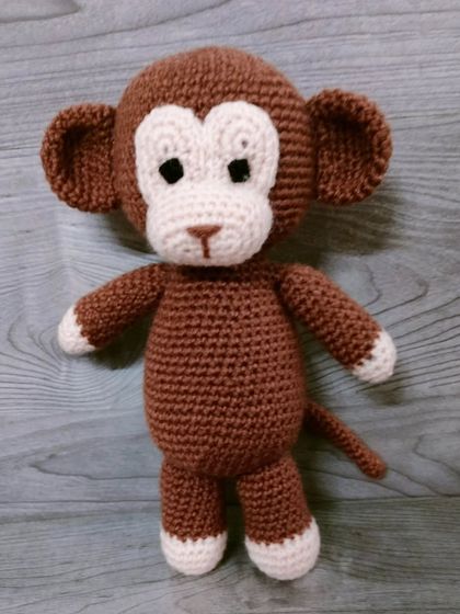 A simple and classic handmade monkey toy. This design is timeless and loved by all children.