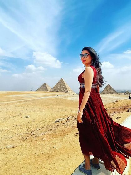Styling is not just for the red carpet, it's for life's adventures too. I had the fun opportunity to style this travel look for Mini Mathur on her trip to Egypt. This flowing red dress was perfect for the dramatic desert landscape, creating a beautiful contrast against the ancient pyramids.