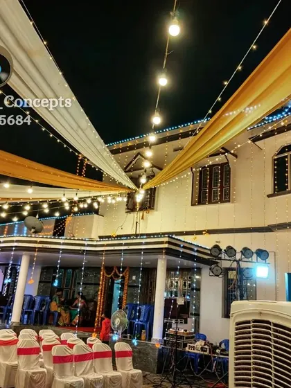 An example of our house lighting services, with elegant white and gold drapery and string lights. This transforms the facade of a home, making it part of the celebration.