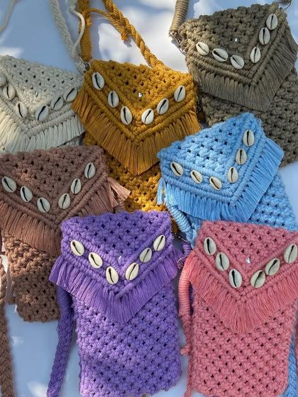 Our mobile slings are an obsession for a reason. Available in a rainbow of colors like mustard, brown, purple, and pink, these shell-detailed slings are stealing hearts everywhere.