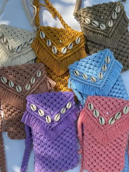 Our mobile slings are an obsession for a reason. Available in a rainbow of colors like mustard, brown, purple, and pink, these shell-detailed slings are stealing hearts everywhere.