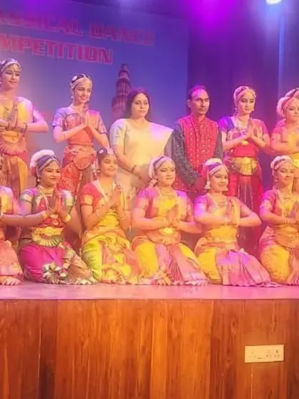 The entire performing team of Nritya Gurukul on stage with the judges. These opportunities are invaluable for my students' growth and exposure.