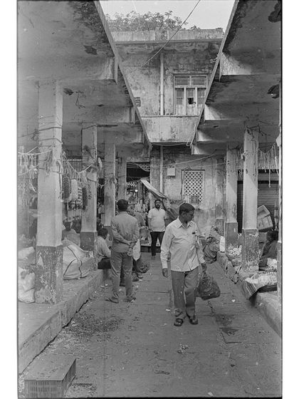 A street scene from a salvaged roll of film. Darkroom techniques allowed us to rescue these images, proving the versatility and resilience of the analog process.