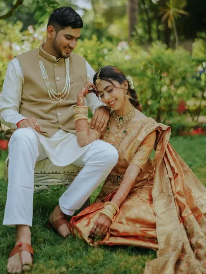 A quiet moment of togetherness. This relaxed outdoor portrait shows the couple sharing a gentle, happy moment, perfectly capturing the comfort and love they share.