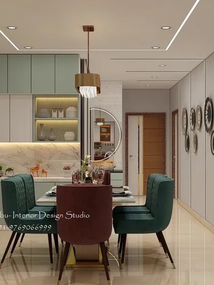 This open-plan living and dining area shows how a consistent color scheme and design language can unite two distinct spaces. The view extends from the dining table to the lobby, showcasing cohesive wall decor.