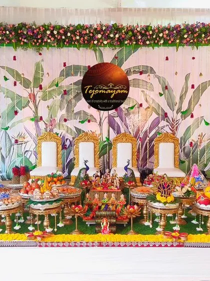 A specialized traditional plate decoration for an Ear Piercing Ceremony, with a beautiful backdrop of banana leaves and floral arrangements.