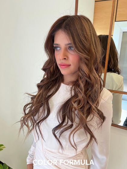 This is a beautiful Caramel Brown balayage created with the Wella Kromatic technique. The look features seamless lightening and toning to achieve these rich, warm, and dimensional results.