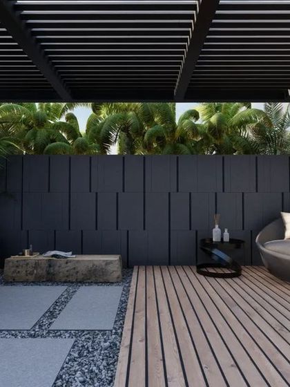 A private garden concept for a hotel suite in Ludhiana, designed for ultimate relaxation. The space includes a wooden deck with a daybed, an open-air shower with a water cascade, and lush tropical planting under a pergola.